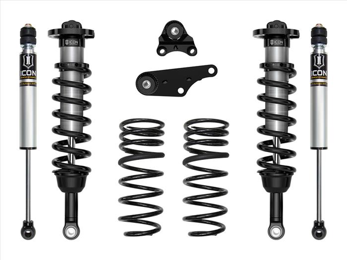 Set of suspension components including shock absorbers and springs on a white background
