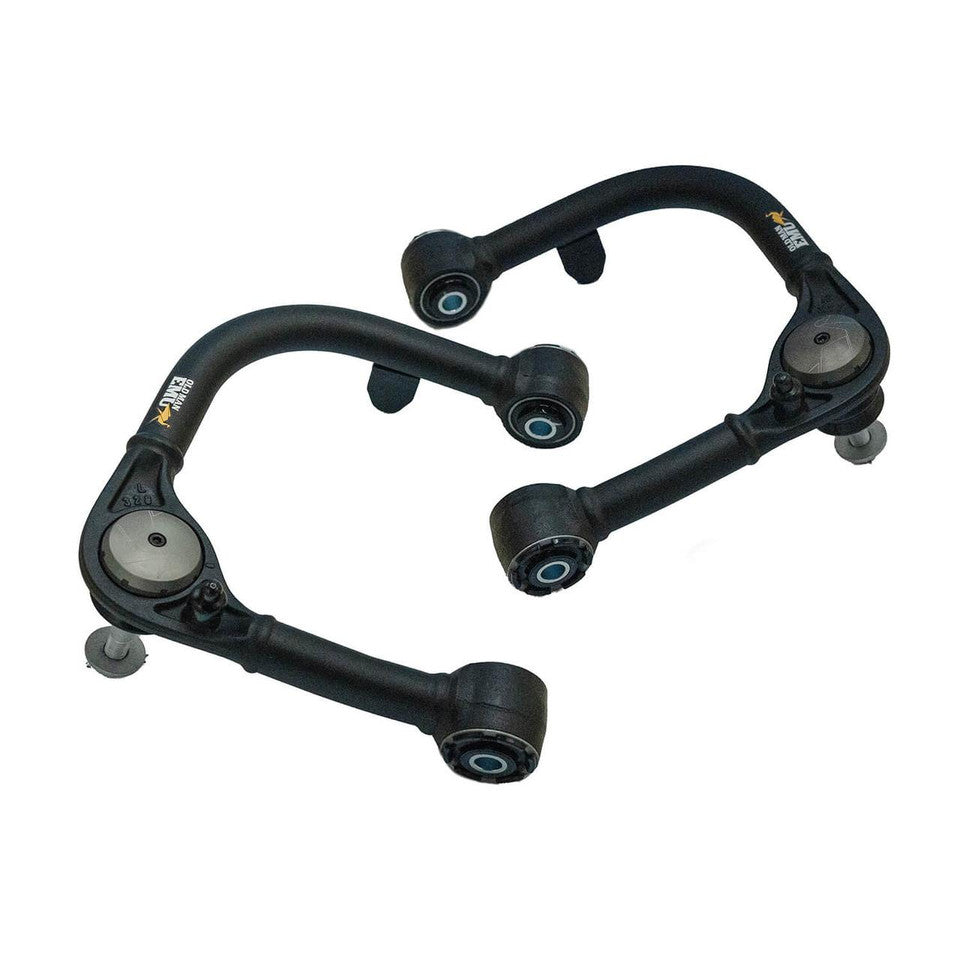 Black OME suspension control arms on a white background