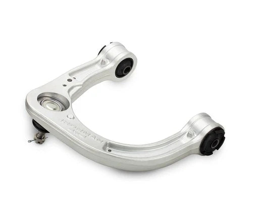 Silver metal control arm on a white background