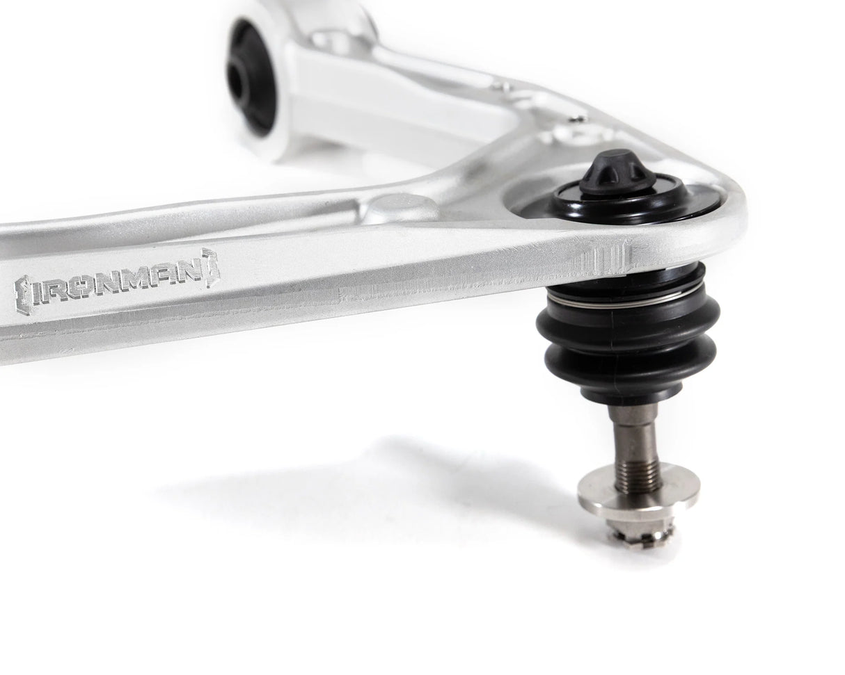 close up of a ball joint on an upper control arm on a white background