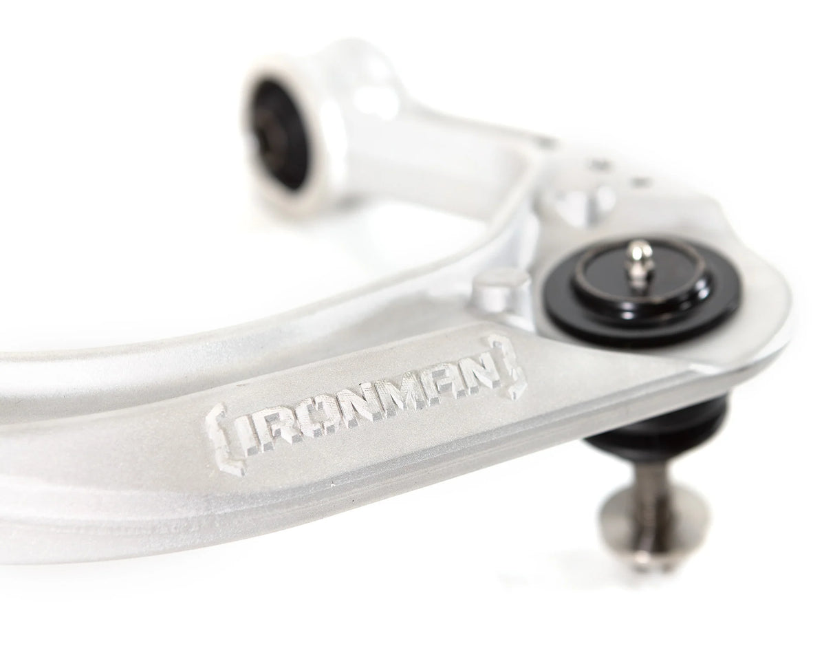 Close-up of an upper control arm with 'Ironman' branding on a white background