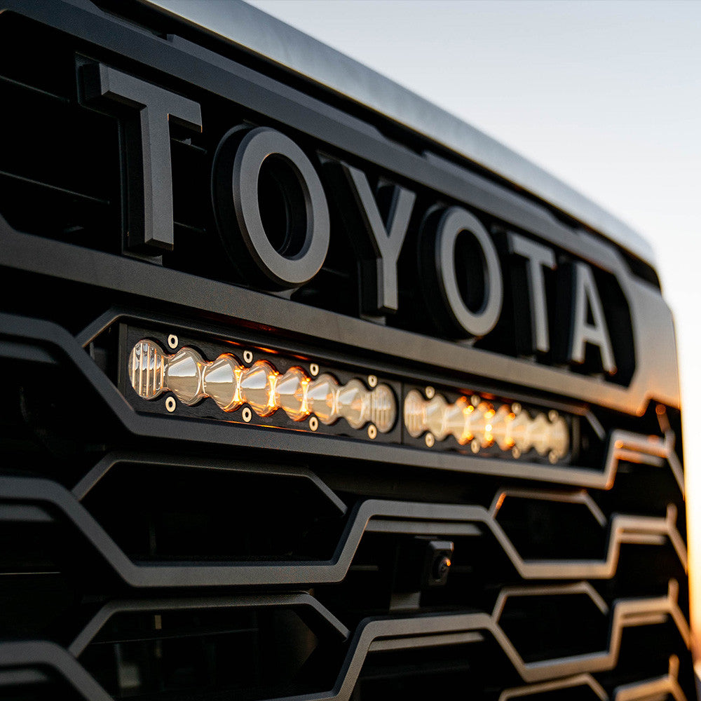 Close-up of a Toyota grille with LED lights