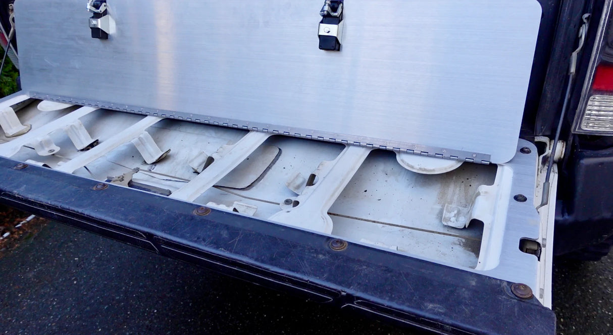 Trunk of a vehicle with a large white object on top