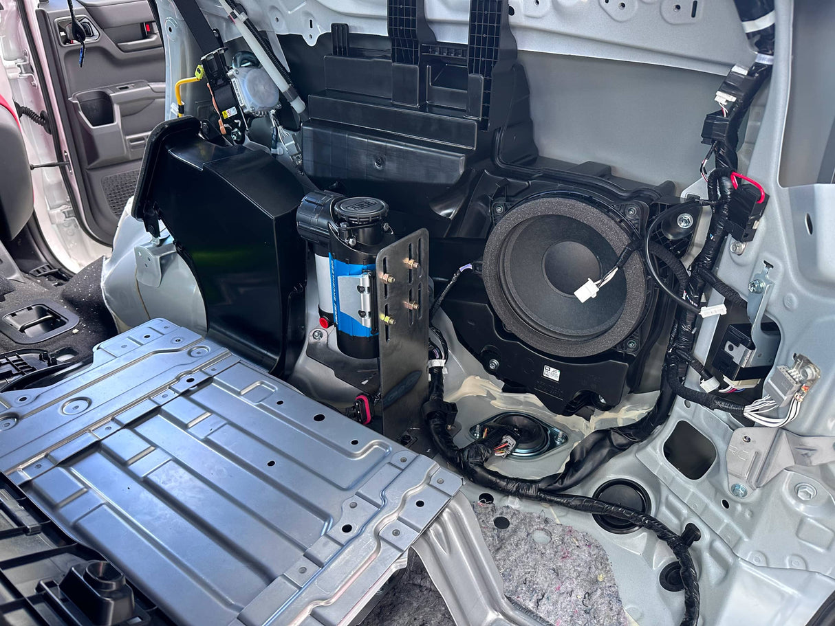 Open car panel revealing electrical components