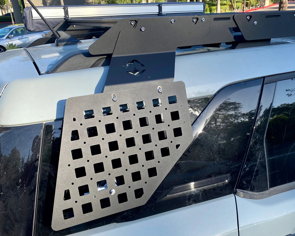 Metal roof rack system on a vehicle with a clear background