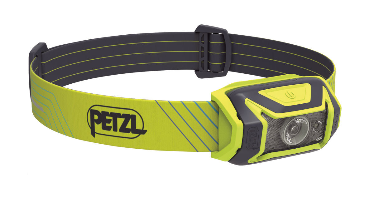 A compact Petzl Tikka Core rechargeable headlamp with a green and black color scheme, showing the front view with LED light and adjustable headband.
