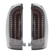 Pair of LED tail lights with chrome accents on a white background