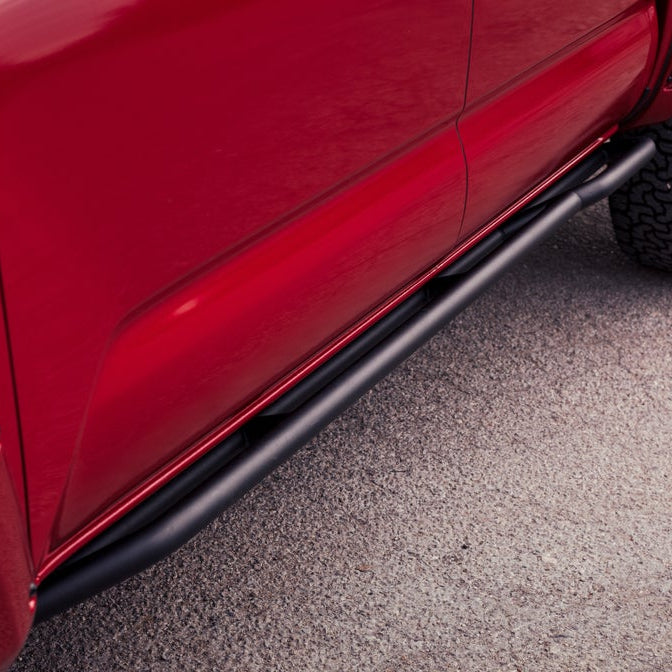 Close up view of powdercoated slider attached to red Tacoma showing small kickout