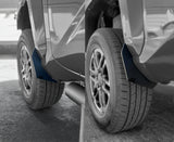 Close-up of car mud flaps on a vehicle with a blurred background