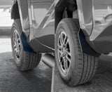 Close-up of car mud flaps on a vehicle with a blurred background