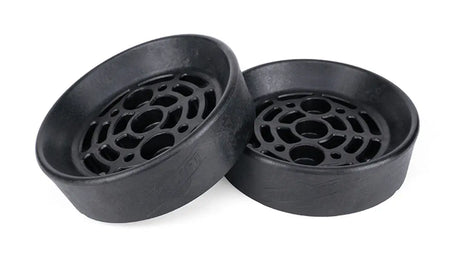 Two black plastic components with circular holes on a white background