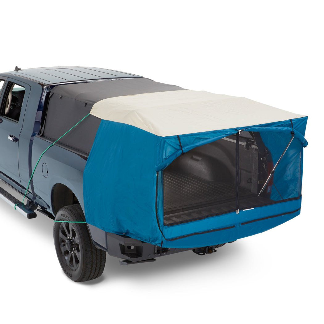 Blue truck bed cover on a gray truck with beige top section on a white background