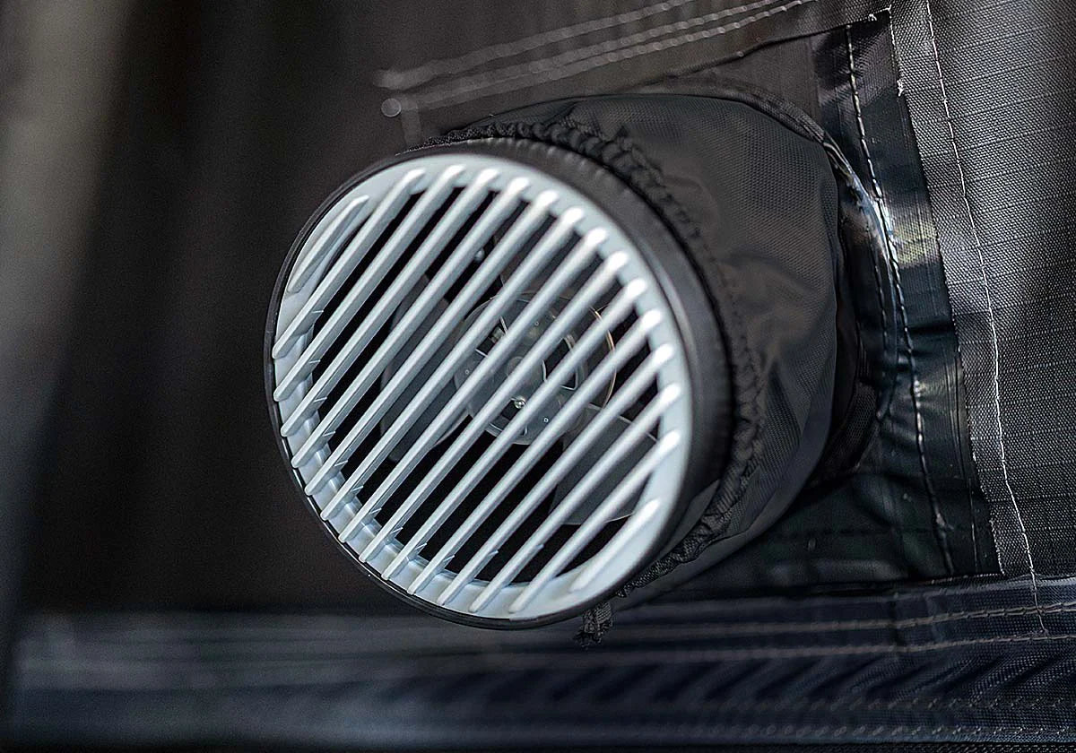 Close-up of a black hvac output on a roof top tent.