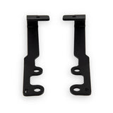 Two black metal brackets on a white background