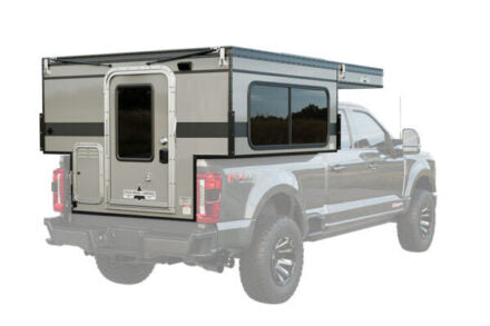 Four Wheel Campers Slide Out model on the bed of a Ford truck