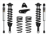 Set of suspension components including shock absorbers and springs on a white background