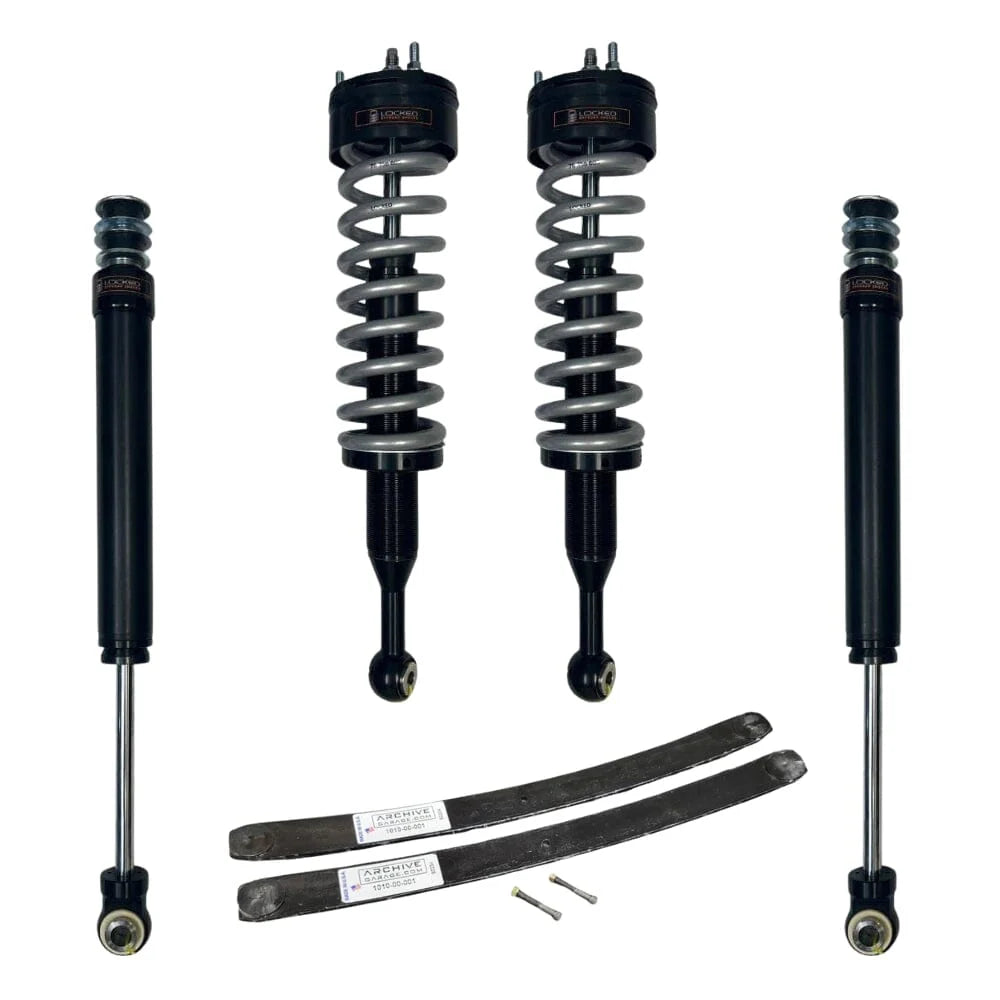Set of car shock absorbers and springs on a white background