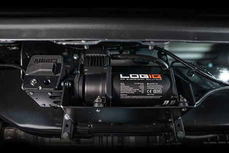 Logiq air compressor system under a vehicle with 'Airlift' branding.