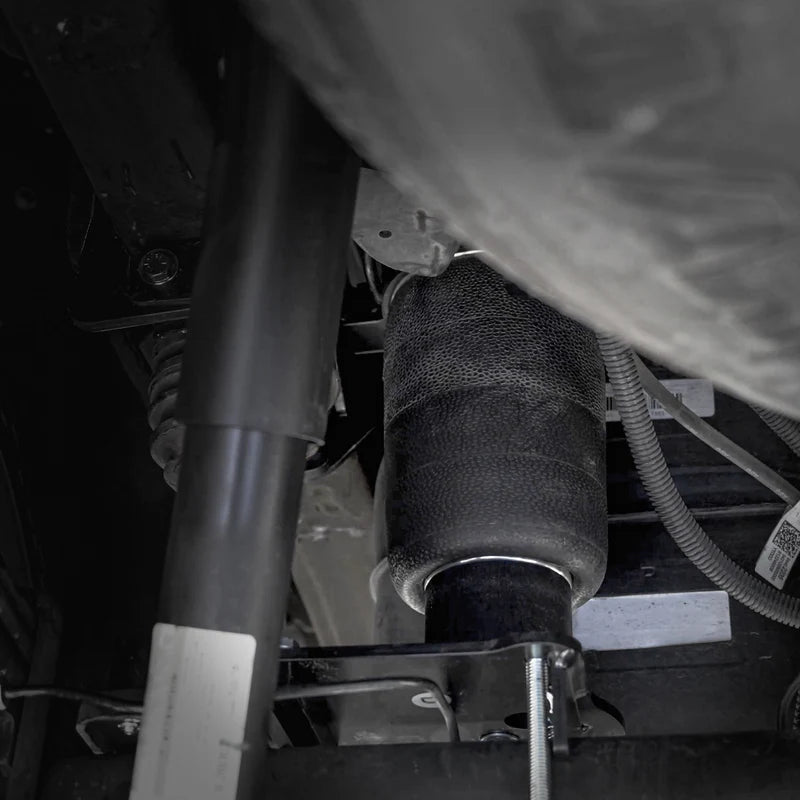 Close-up of a car's air suspension system.