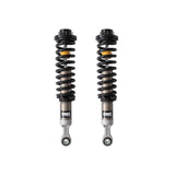 Black, silver and yellow coilovers on a white background