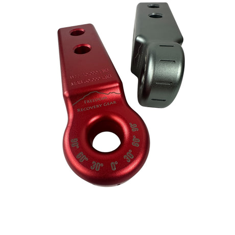 Red metal recovery hook and gray metal bracket on a white background