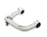 Silver metal control arm on a white background
