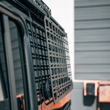 Close-up of a vehicle grille with a blurred background