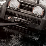 Front bumper of a vehicle with ARB lights installed on a natural background