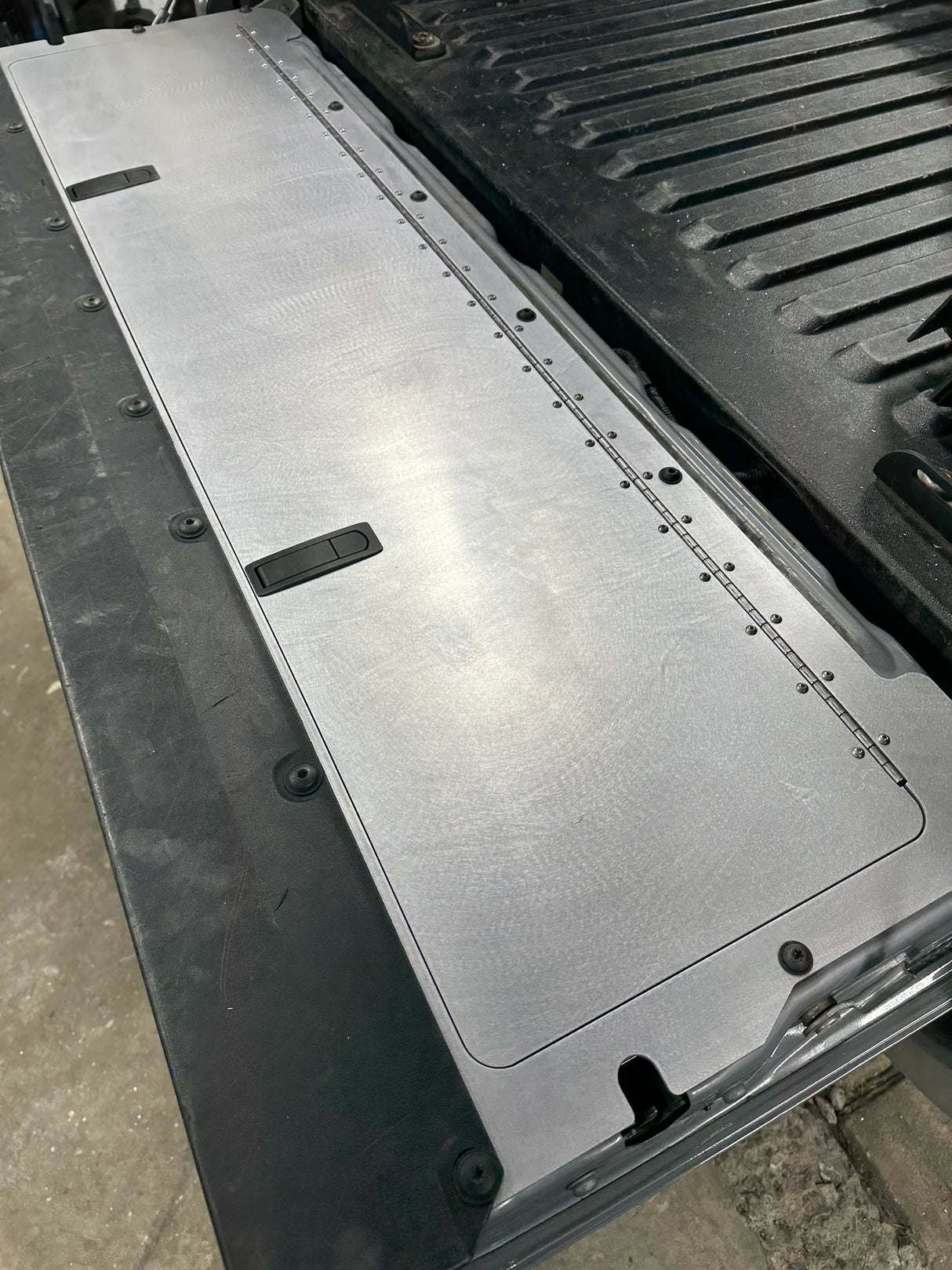 Metal floor mat in a vehicle's cargo area