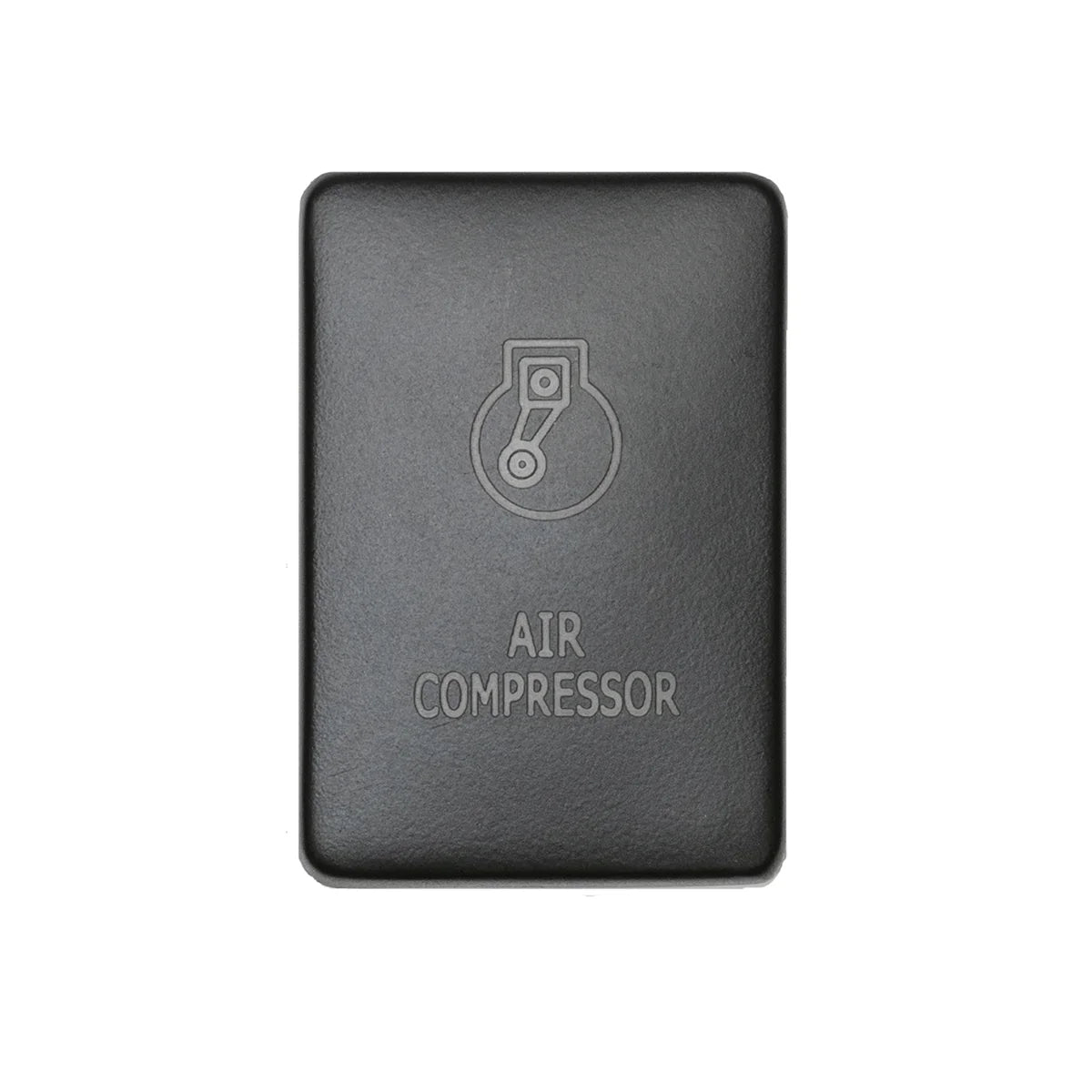 Front facing small air compressor switch in front of white backdrop