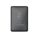 Front facing small air compressor switch in front of white backdrop