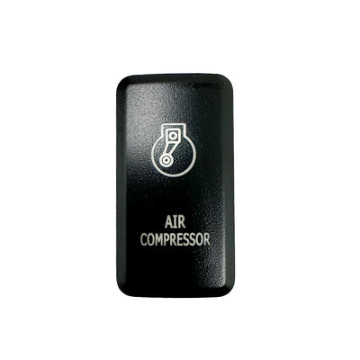 Front facing tall air compressor switch in front of white backdrop