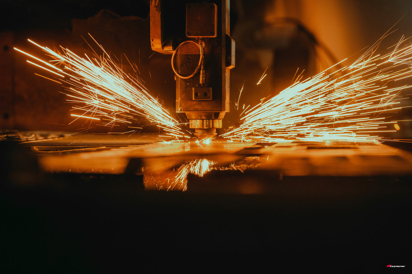 Metal cutting process with sparks in an industrial setting