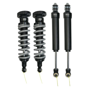 Two pairs of shock absorbers on a white background
