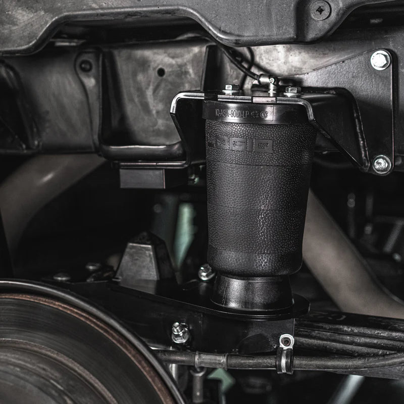 Close-up of a suspension shock absorber on a vehicle