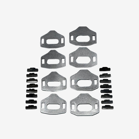 Set of metal brackets and fasteners on a gray background