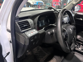 Car interior with steering wheel and dashboard view