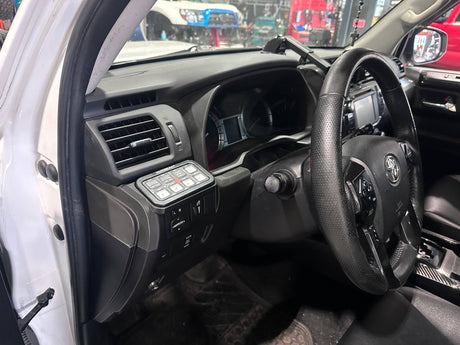 Car interior with steering wheel and dashboard view
