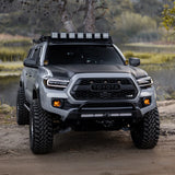 Toyota truck on a dirt road with a scenic background
