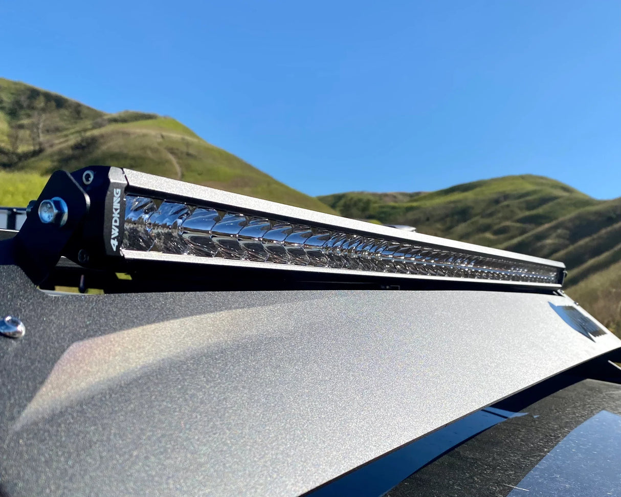 LED light bar on a vehicle with a mountainous landscape in the background