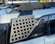 Metal roof rack system on a vehicle with a clear background