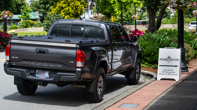 Diamondback Tonneau Cover on a black Toyota Tacoma in Cloverdale 