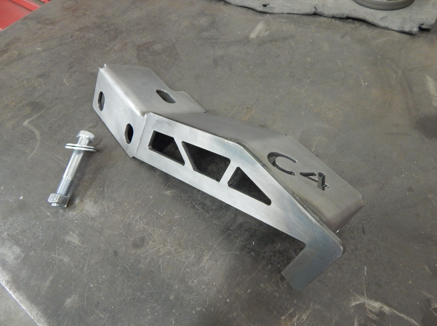 Frame Support Bracket with previous C4 logo (passenger side)