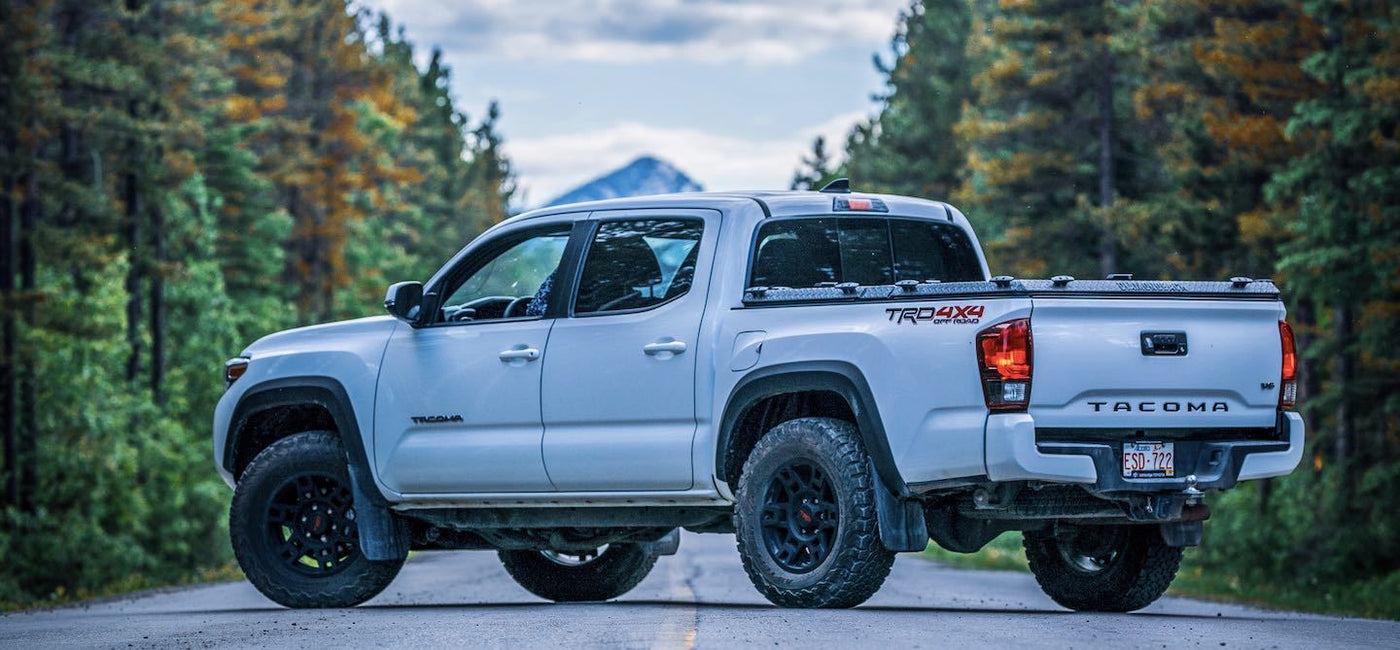 DiamondBack HD Tonneau Cover on a white Tacoma truck